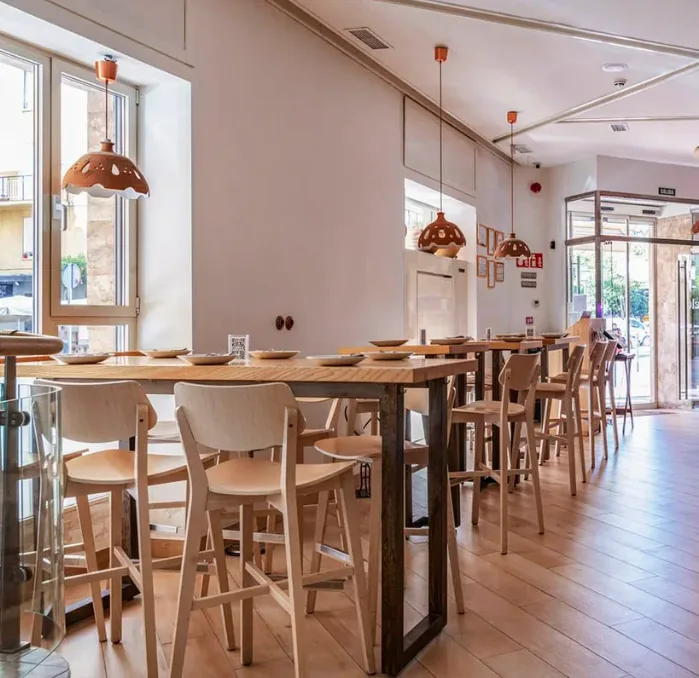 Dining room with high counter, stools and natural light