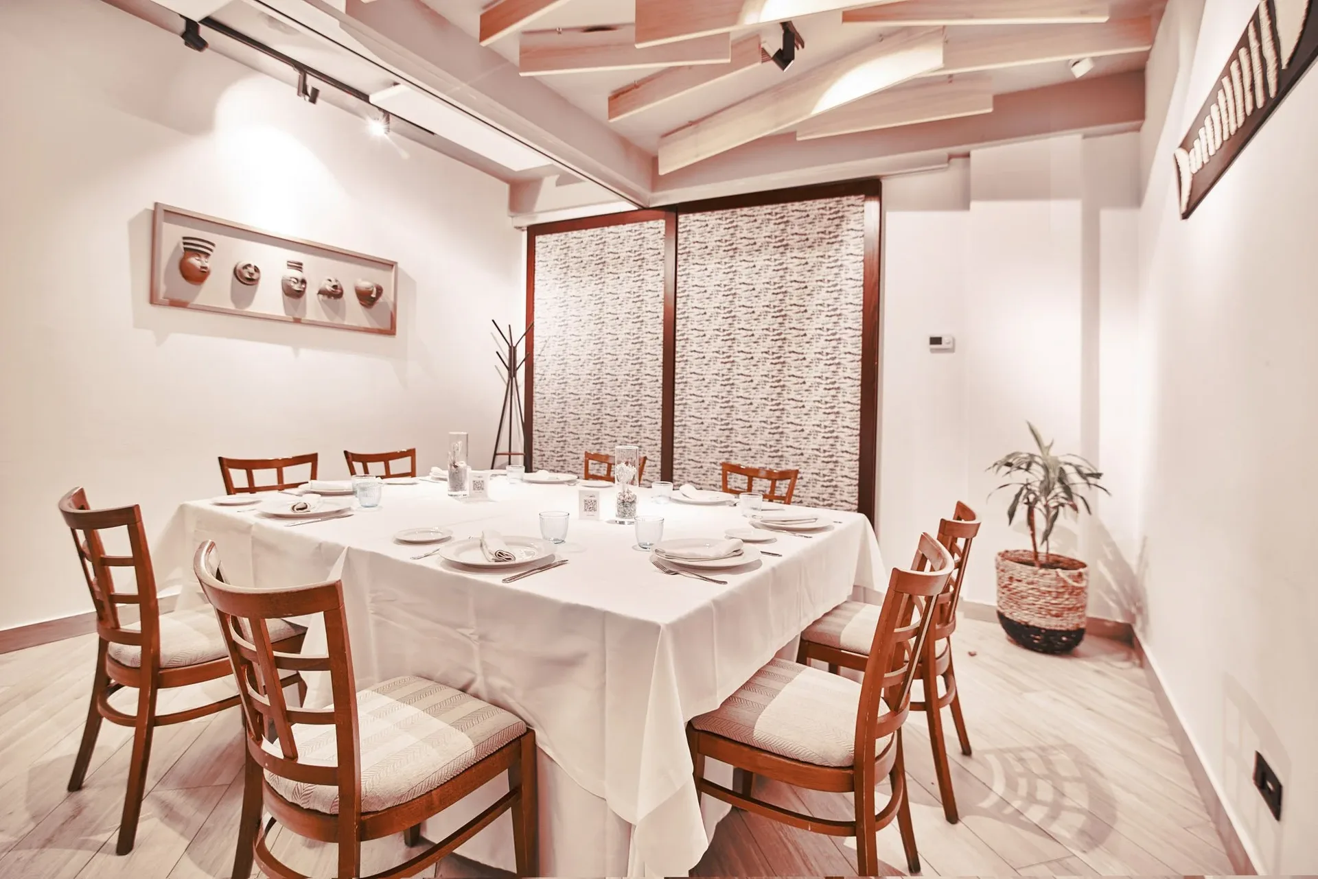 Private room with a table set for a group meal