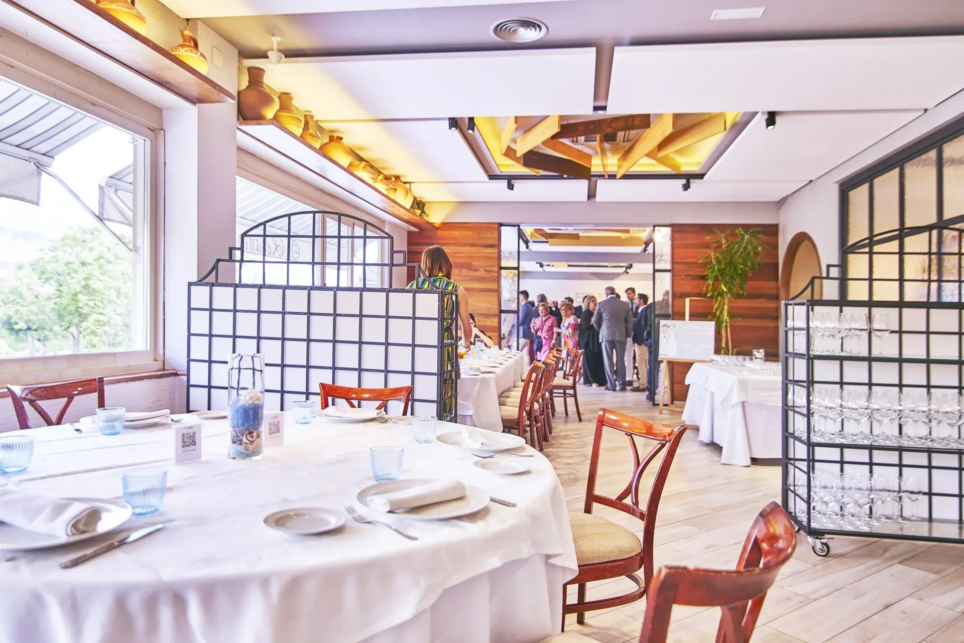 Banquet room with round tables and white linens